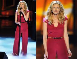 This is an amazing likeness of me and my jumpsuit except: my jumpsuit was long-sleeved, I wasn't standing behind a microphone, and I had a huge Italian Dressing splotch shining where my cleavage should have been shining. Oh, And I wasn't as popular as Faith Hill.