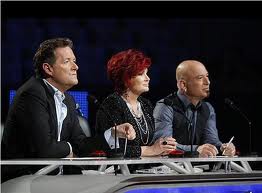 Where am I in this panel of judges? I should be there instead of germ-o-phobe bald guy. 