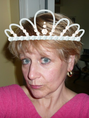 The tiara helps keep my hair in place on windy days. And when cameras are around.