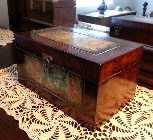 I picked the box because the decorative part reminded me a bit of an old time world map. Scrappy--ever the traveler...